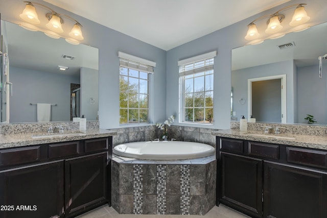 bathroom with vanity, tile patterned flooring, and independent shower and bath