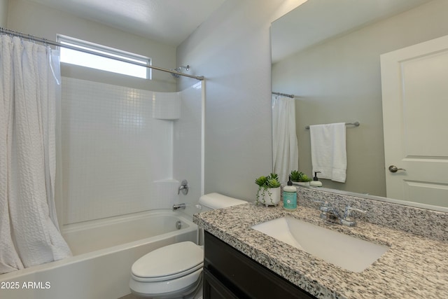 full bathroom with vanity, shower / tub combo, and toilet