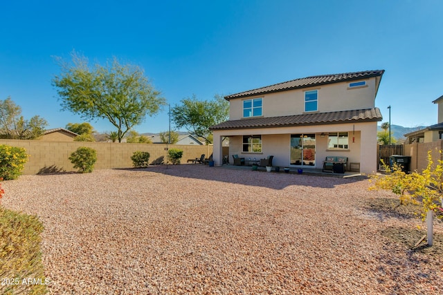 rear view of house featuring a patio area