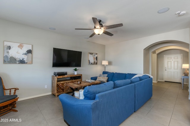 living room with tile patterned flooring and ceiling fan