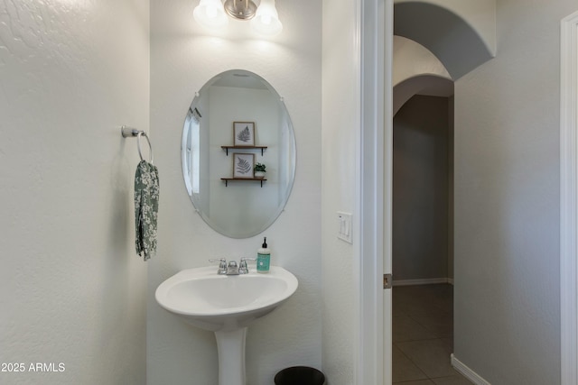 bathroom with tile patterned floors