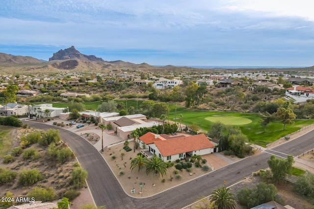 birds eye view of property with a mountain view