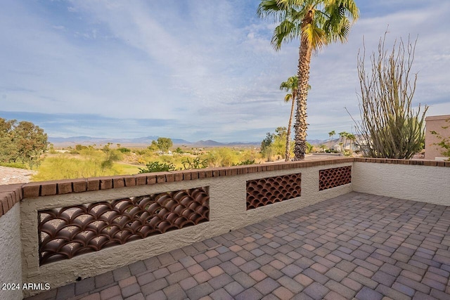 view of patio / terrace with a mountain view