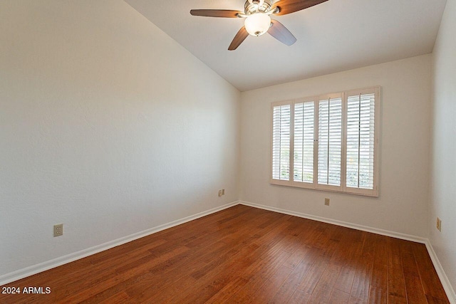 spare room featuring vaulted ceiling, ceiling fan, and dark hardwood / wood-style flooring