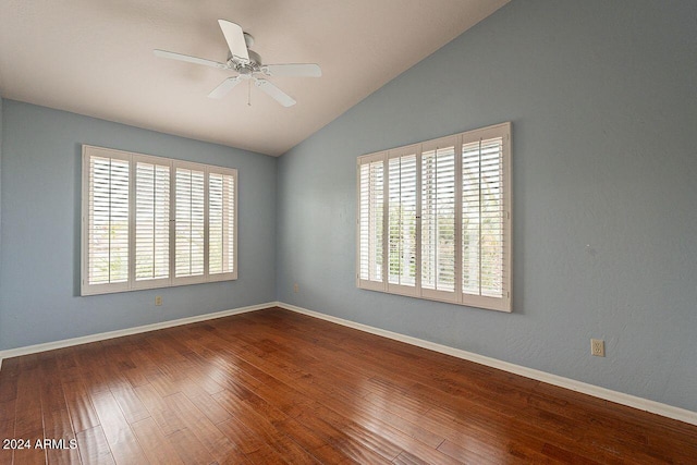 spare room with lofted ceiling, hardwood / wood-style floors, and ceiling fan