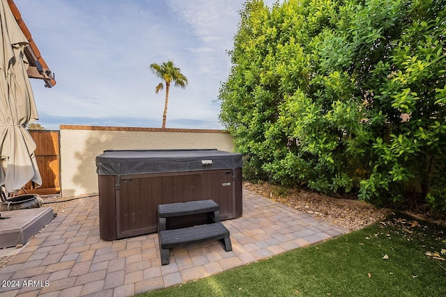 view of patio with a hot tub