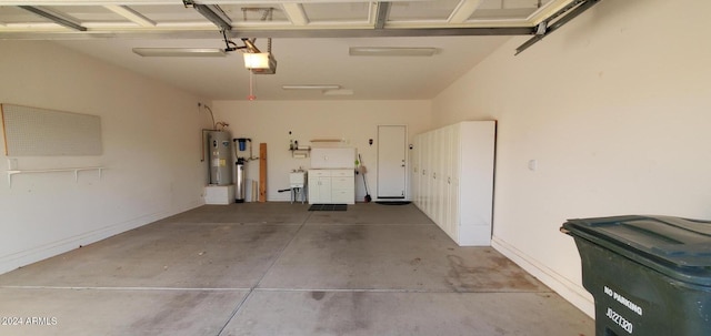 garage featuring a garage door opener and electric water heater