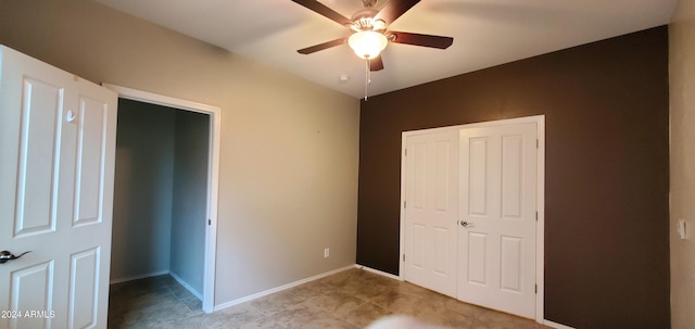 unfurnished bedroom featuring ceiling fan