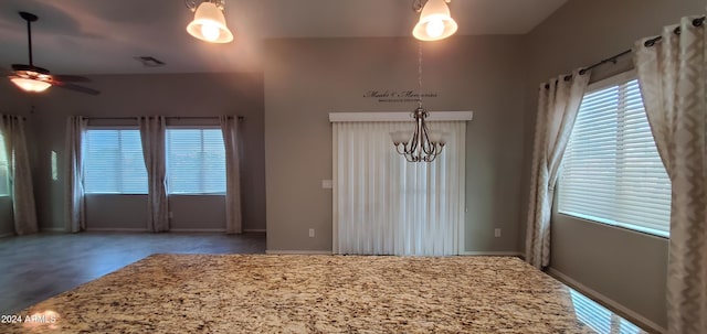 unfurnished dining area featuring ceiling fan