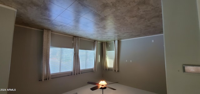 spare room with ceiling fan