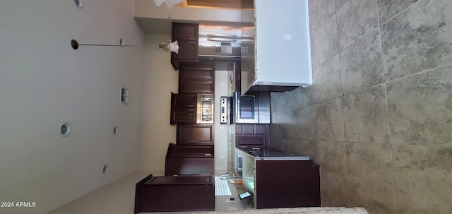 kitchen featuring dark brown cabinetry