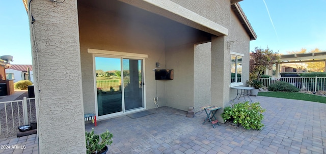 property entrance with a patio area