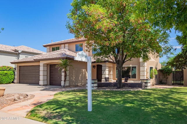 view of front facade with a garage and a front lawn