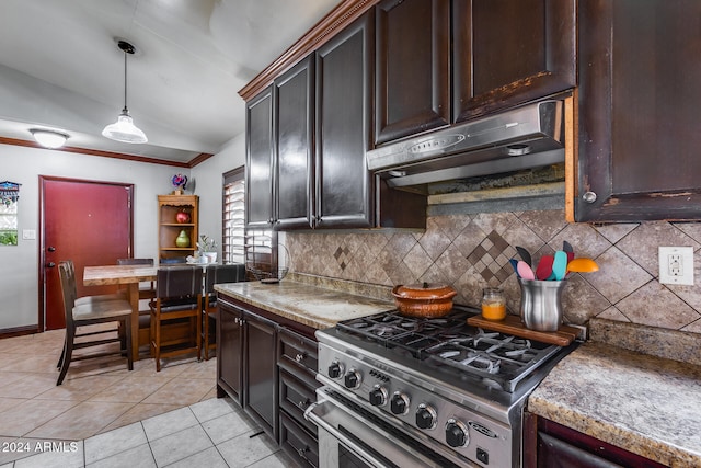 kitchen with vaulted ceiling, light tile patterned floors, tasteful backsplash, stainless steel range, and dark brown cabinets