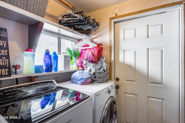 laundry area with washing machine and clothes dryer