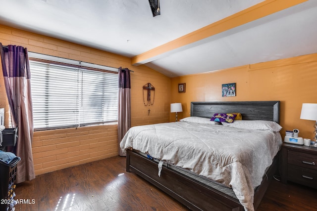 bedroom with dark wood-type flooring, ceiling fan, brick wall, and lofted ceiling with beams