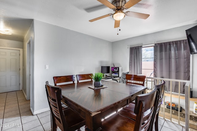 tiled dining room with ceiling fan