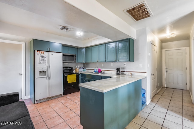 kitchen featuring light tile patterned flooring, blue cabinetry, white fridge with ice dispenser, black / electric stove, and kitchen peninsula