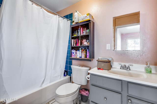 full bathroom with shower / bath combo, tile patterned flooring, vanity, and toilet