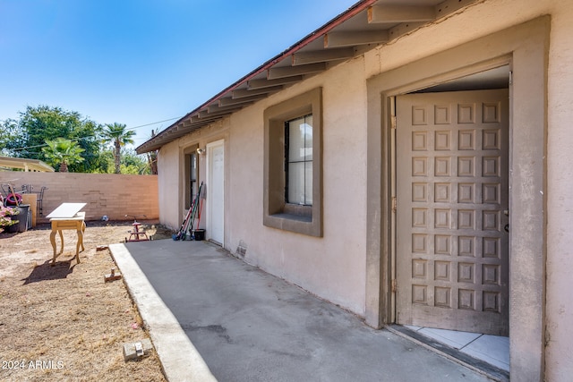 entrance to property featuring a patio area