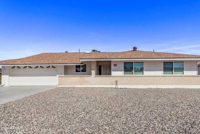 ranch-style home with a garage