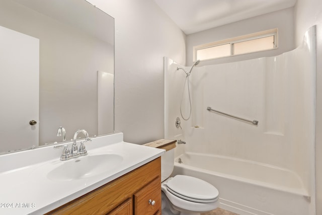 full bathroom featuring vanity, shower / tub combination, and toilet