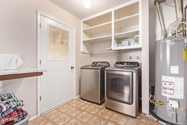 clothes washing area with washing machine and clothes dryer and gas water heater