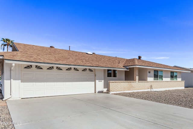 ranch-style home with a garage