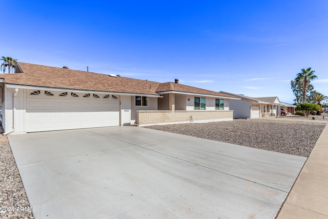 ranch-style home featuring a garage