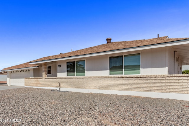 ranch-style home featuring a garage