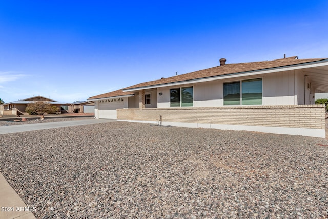 single story home featuring a garage