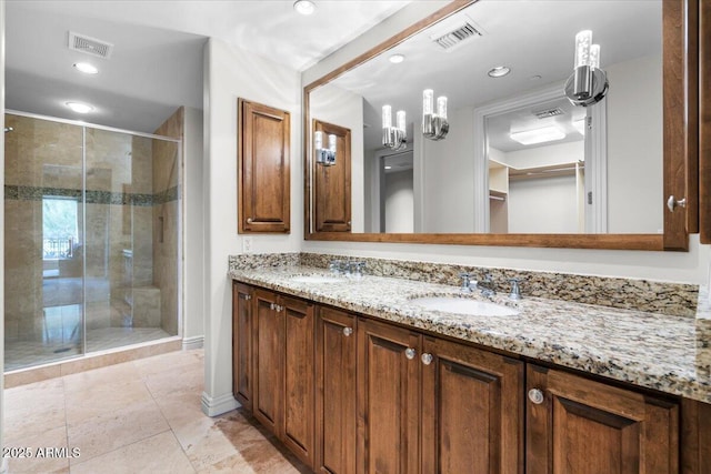 bathroom with walk in shower and vanity