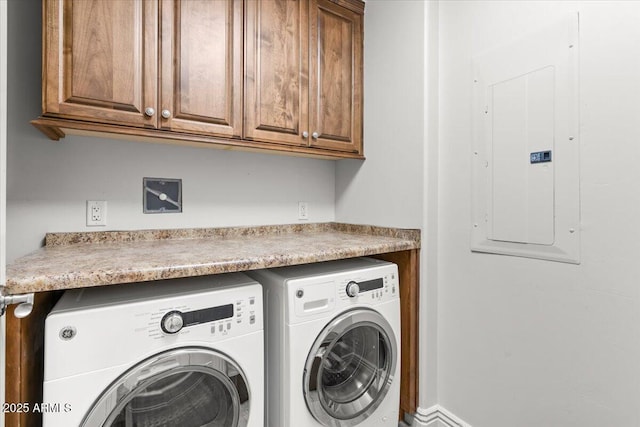 laundry area with cabinets, electric panel, and washing machine and dryer