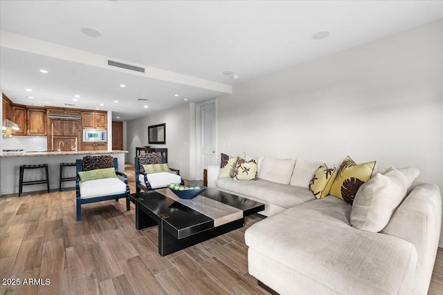 living room featuring light wood-type flooring