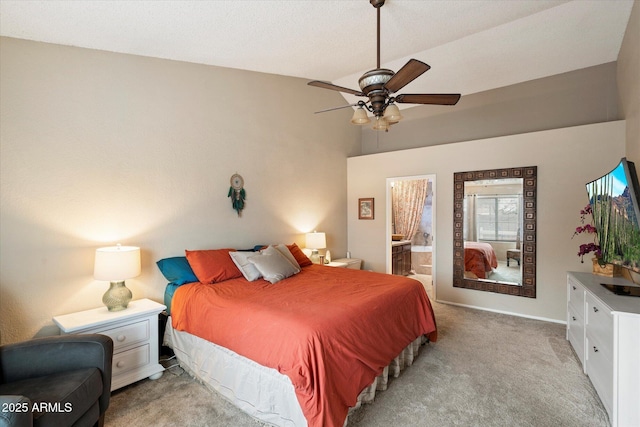 carpeted bedroom with connected bathroom and ceiling fan