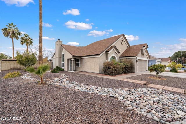 view of front of property with a garage