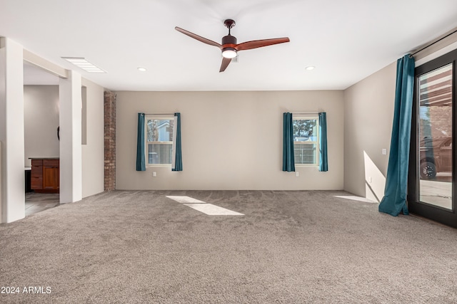 interior space with ceiling fan