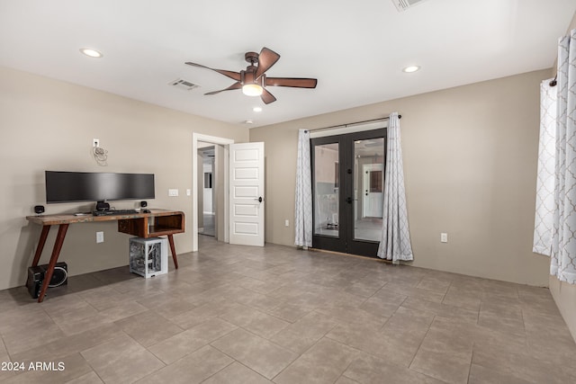 tiled home office with ceiling fan and french doors