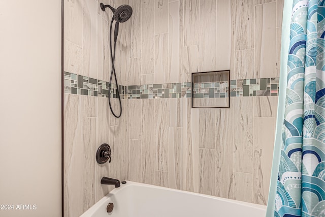 bathroom featuring shower / bath combo with shower curtain