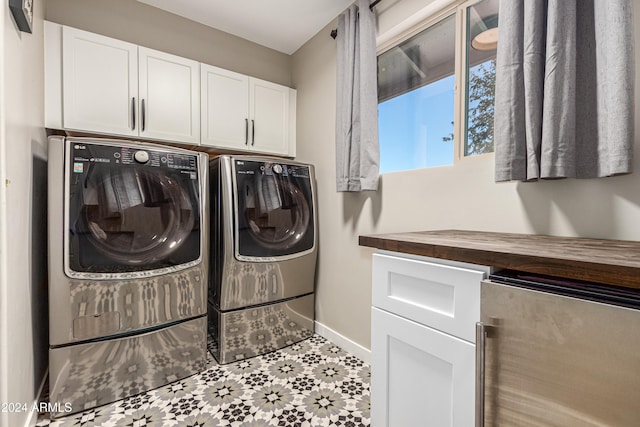 clothes washing area with cabinets, separate washer and dryer, and beverage cooler