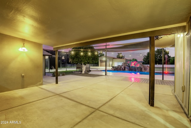 view of patio terrace at dusk