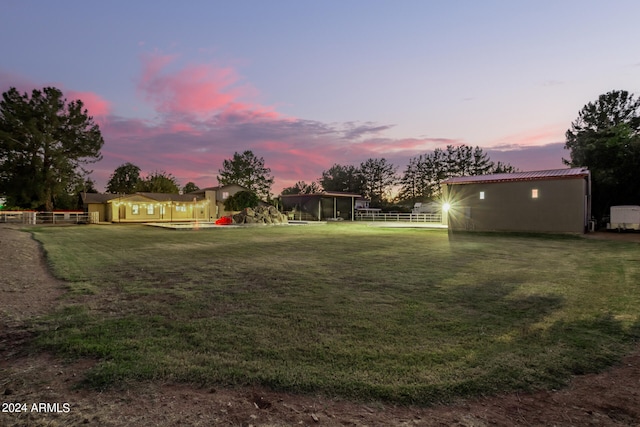 view of yard at dusk