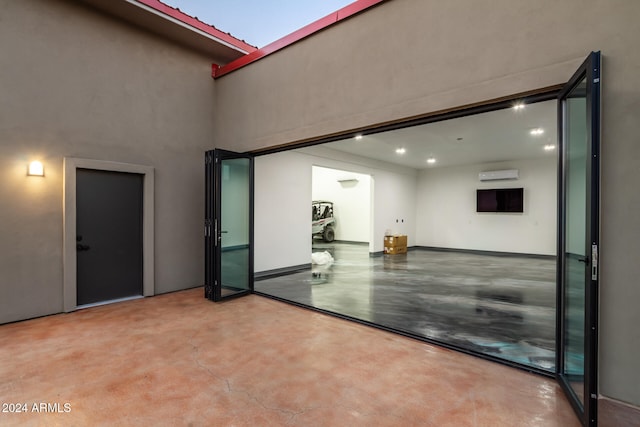 view of patio featuring a wall mounted air conditioner