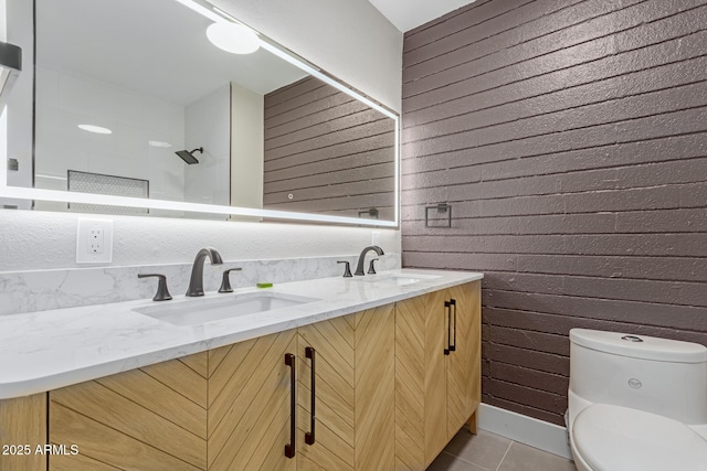 bathroom featuring tile patterned floors, toilet, double vanity, wood walls, and a shower