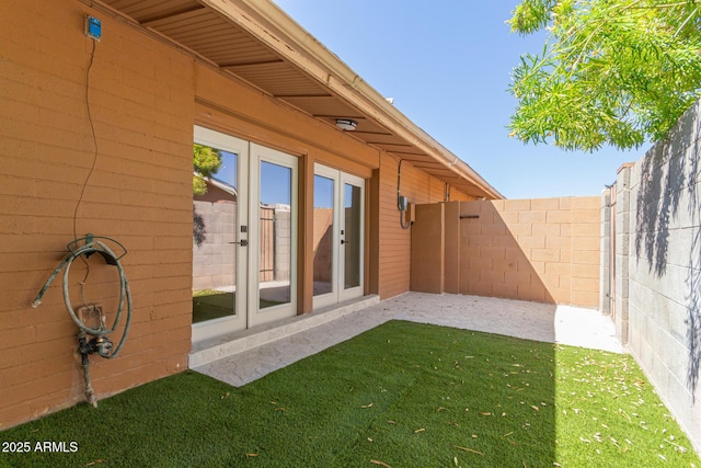 view of yard featuring french doors