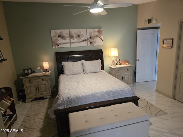 bedroom with baseboards, marble finish floor, visible vents, and a ceiling fan