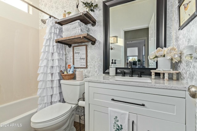 full bathroom with shower / tub combo, vanity, and toilet