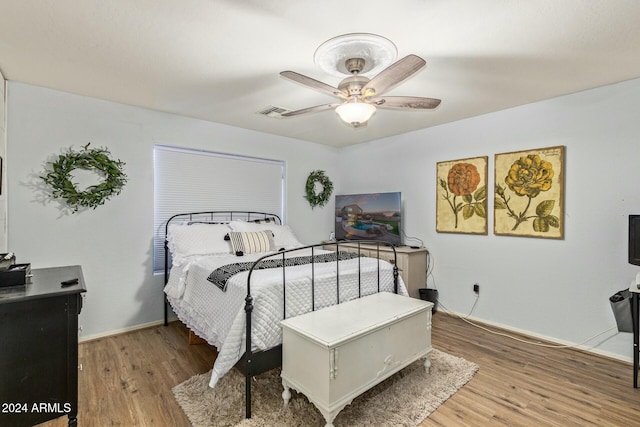 bedroom featuring ceiling fan and light hardwood / wood-style floors