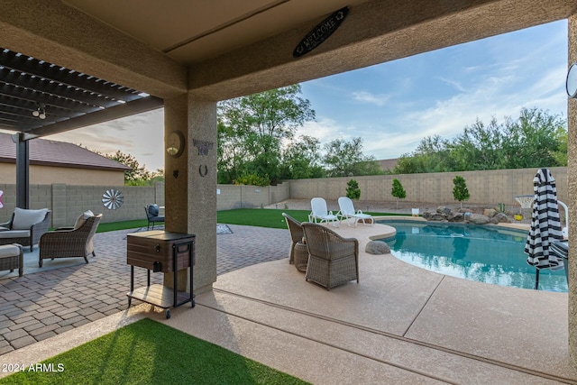 view of patio featuring a fenced in pool