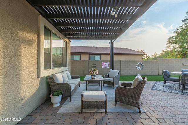 patio terrace at dusk featuring outdoor lounge area and a pergola